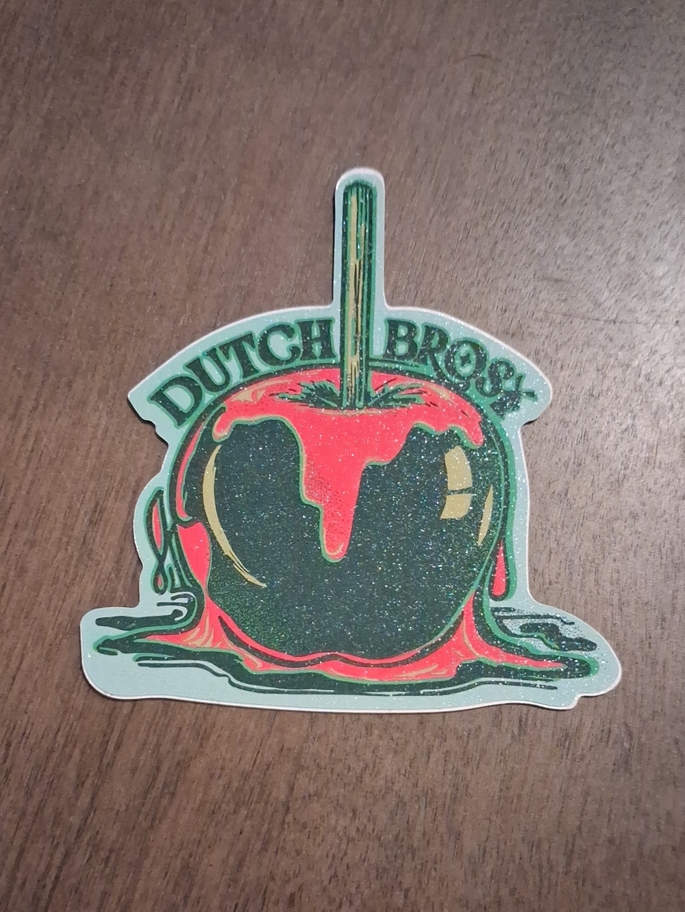 Dutch Bros Green & Red Candy Apple Sticker with Gold Accents